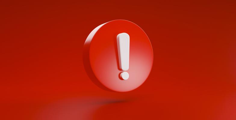 Wykrzyknik biały na czerwonym tle